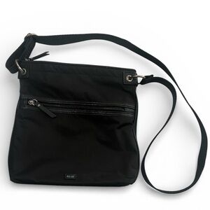 The Sak Esperato Flat Crossbody bag in black Ecotwill color.